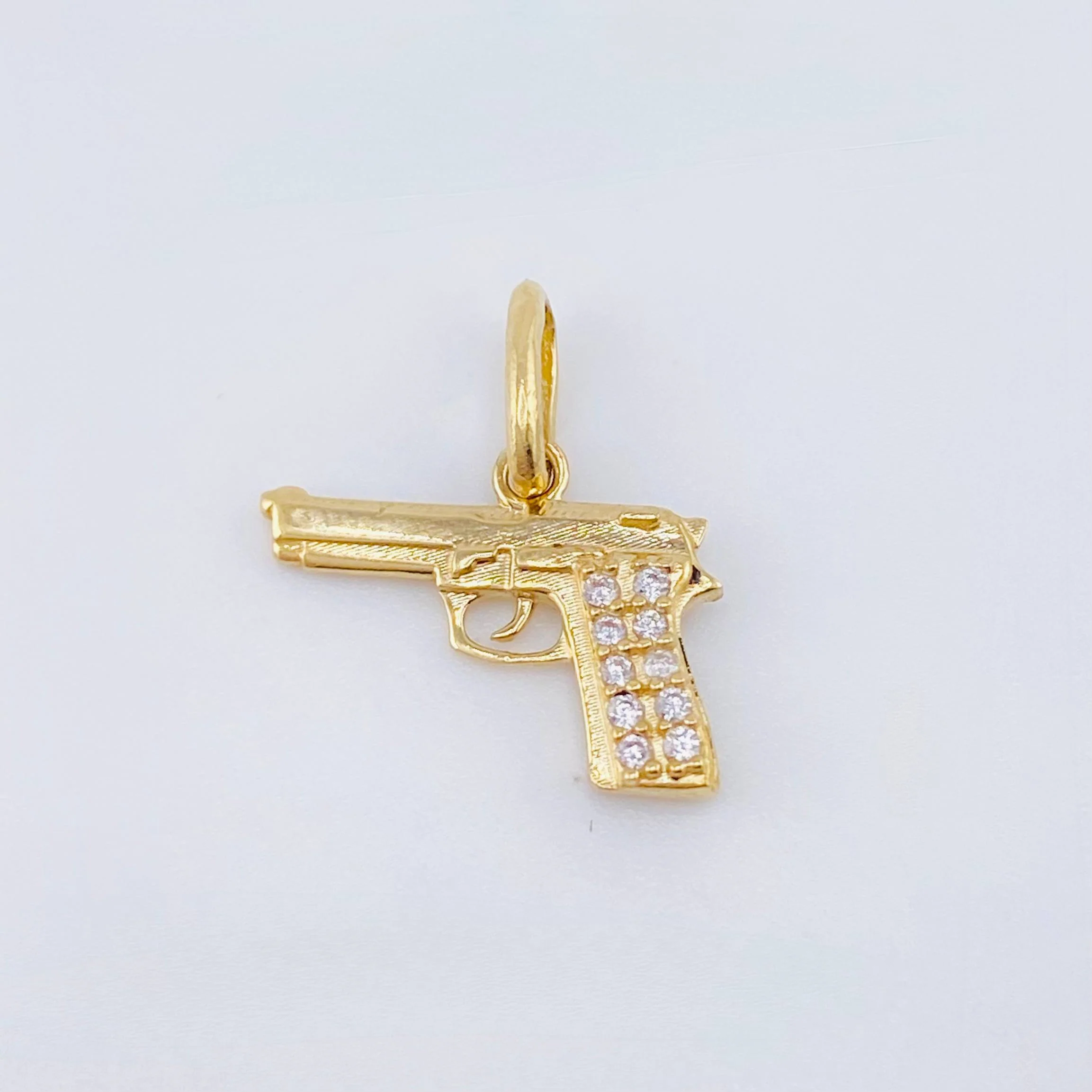 Dije Pistola 1.15gr / 1.5cm / Oro Amarillo 18K ©