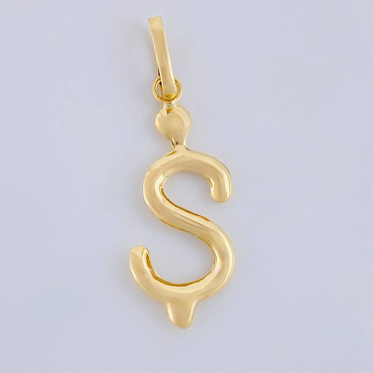 Dije Signo Pesos 0.75g / 3cm Oro Amarillo 18K