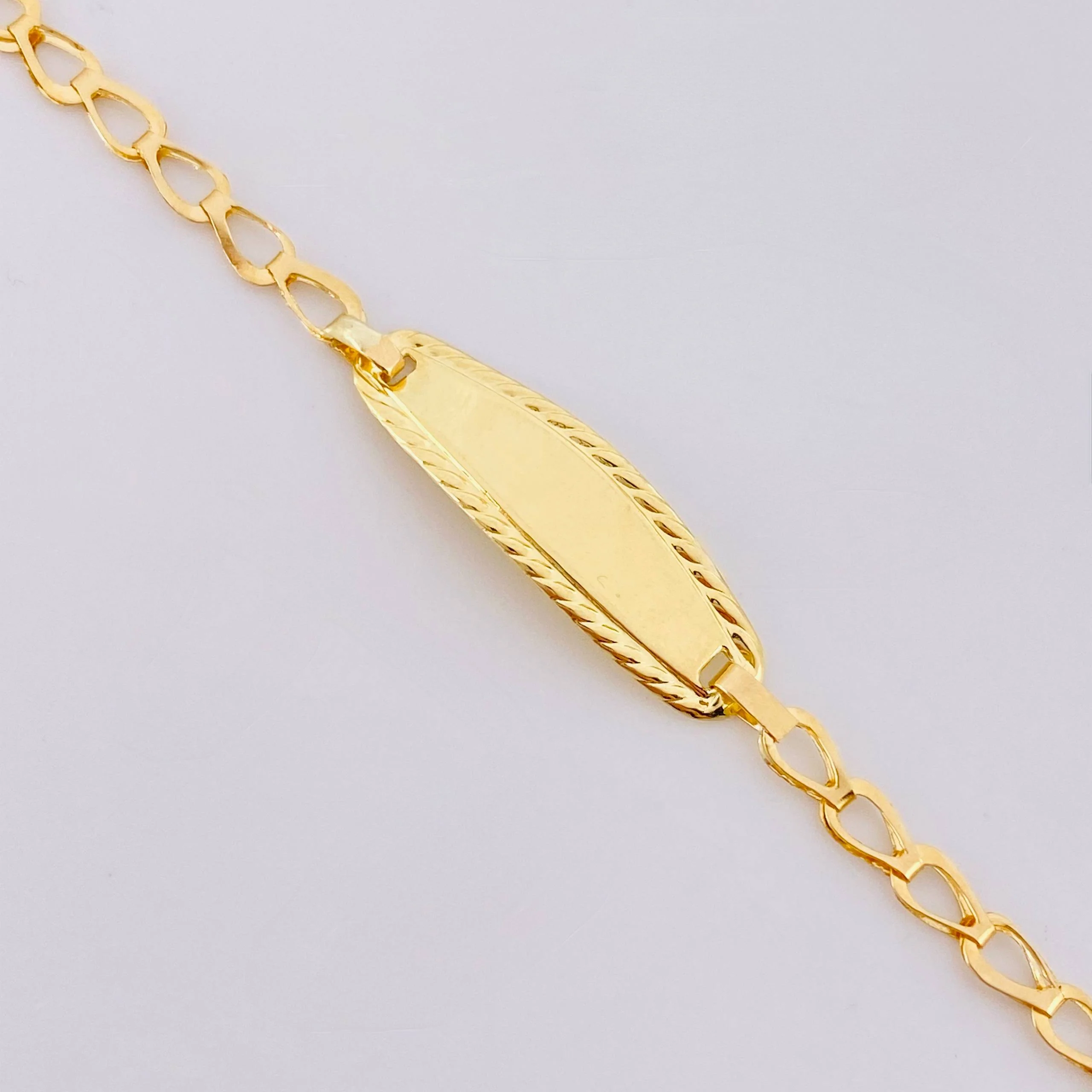 Pulso Bebé Espiga Placa Ovalada Bordeada 1.2gr / 14.5cm / 2.7mm Oro Amarillo 18K - Image 4
