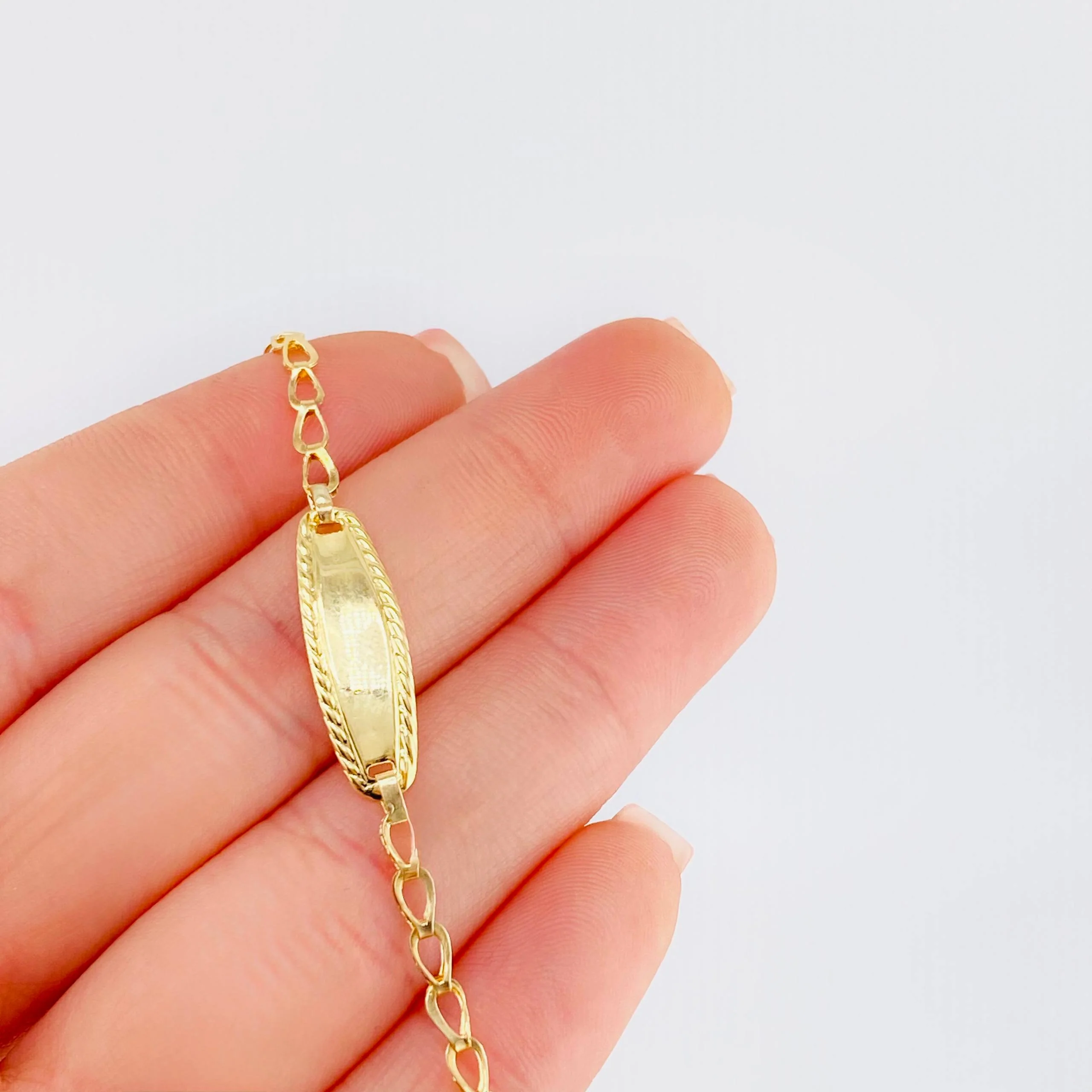 Pulso Bebé Espiga Placa Ovalada Bordeada 1.2gr / 14.5cm / 2.7mm Oro Amarillo 18K - Image 5