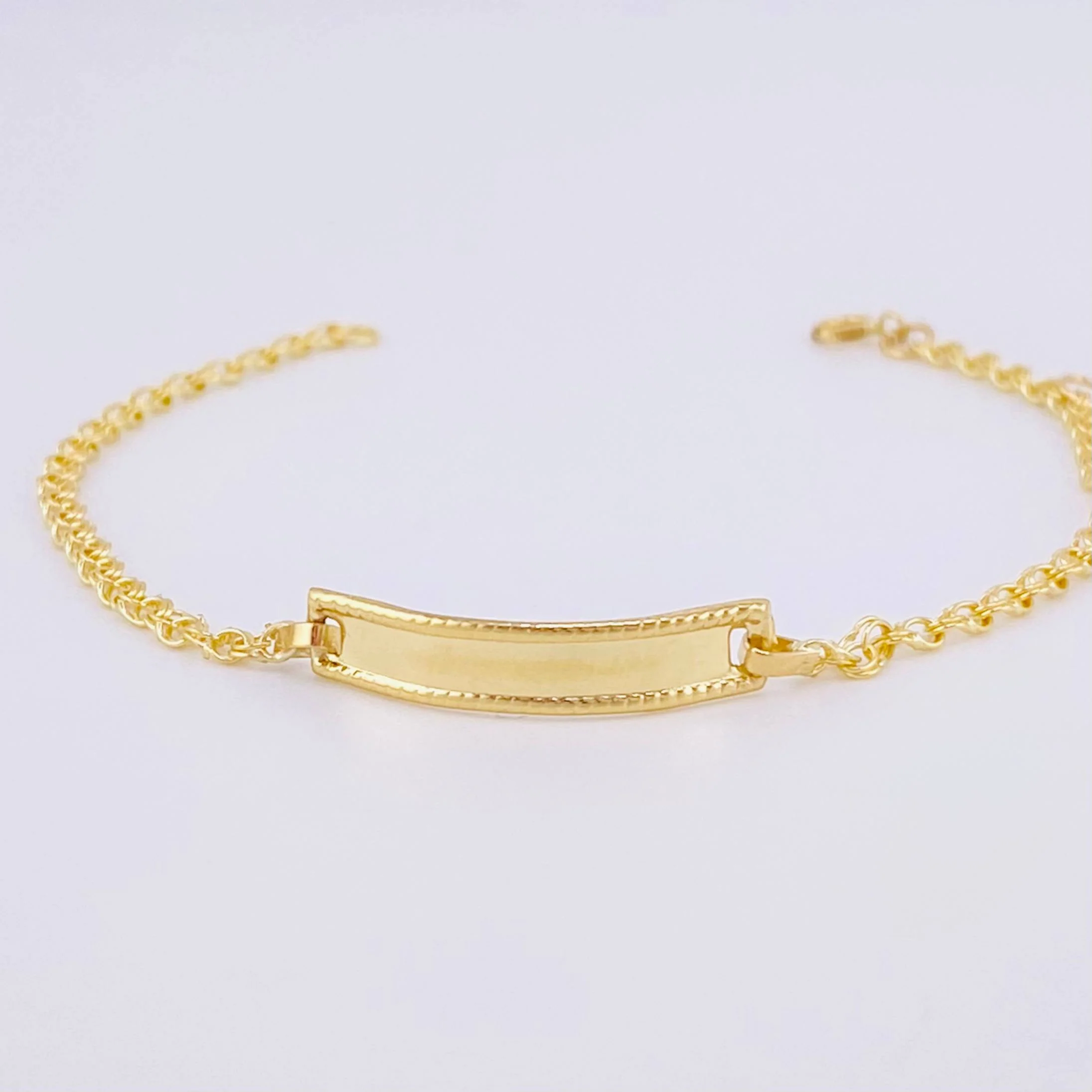 Pulso Bebé Roll ON Placa Rectangular Relieve 1.35gr / 14.5cm / 2.3mm Oro Amarillo 18K - Image 2