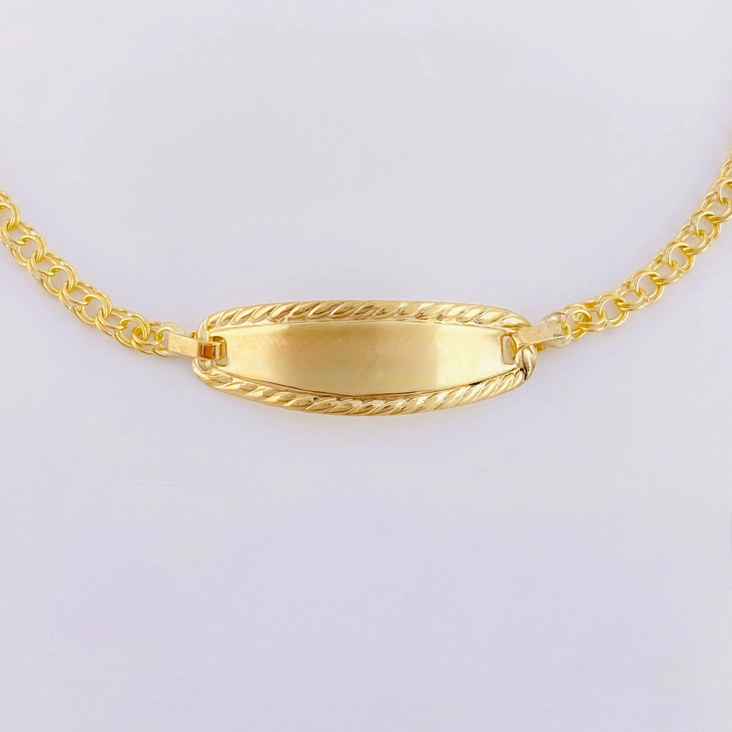 Pulso Bebé Roll On Placa Ovalada Relieve 1.35gr / 14.5cm / 2.3mm Oro Amarillo 18K