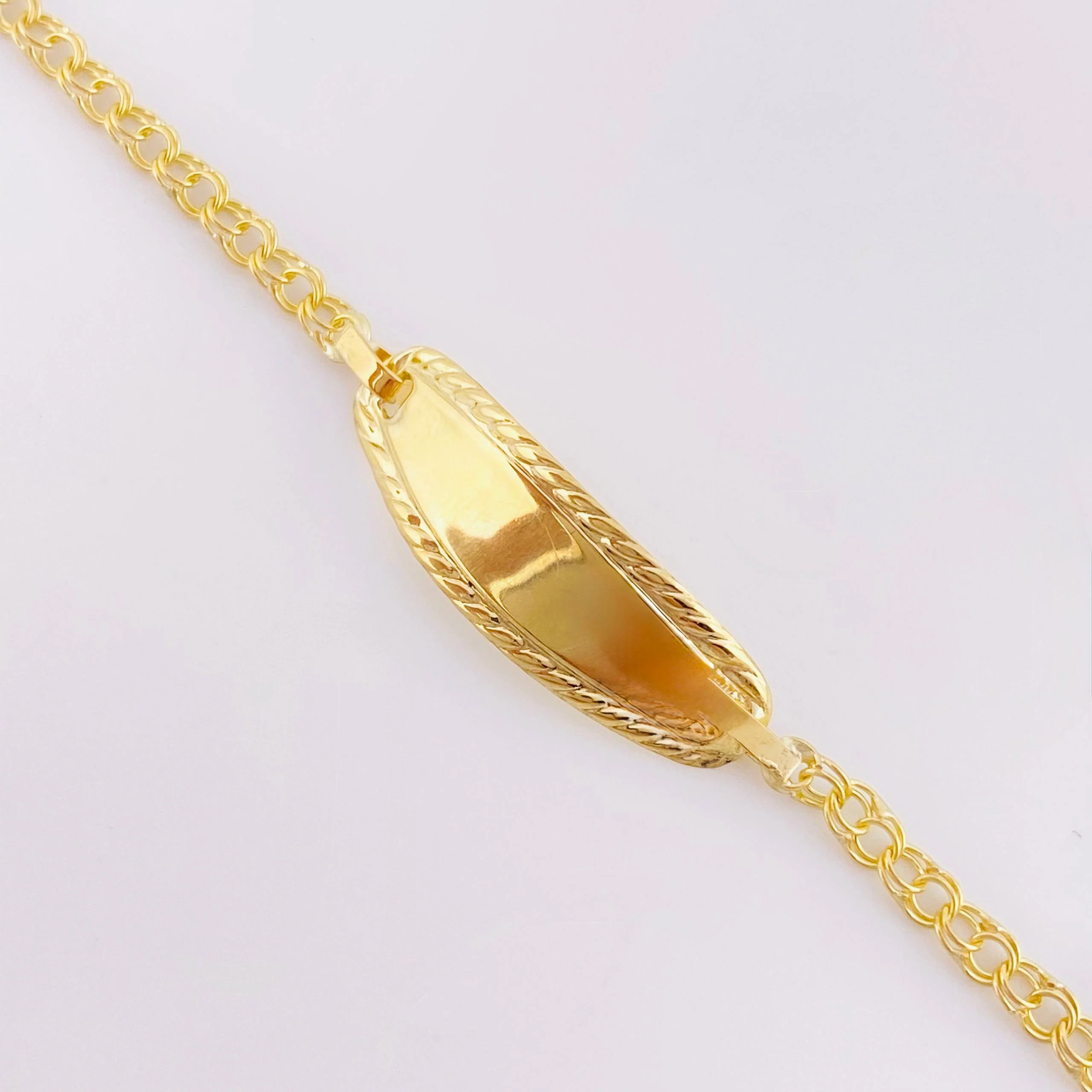 Pulso Bebé Roll On Placa Ovalada Relieve 1.35gr / 14.5cm / 2.3mm Oro Amarillo 18K - Image 2
